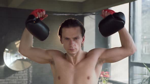 Portrait of male boxer in the gym