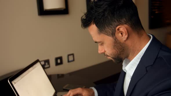 Businessman working on laptop 4k