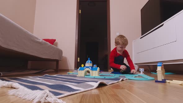 Playful Boy And Toy Cars