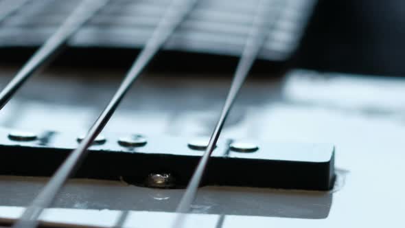 Musician Closes Guitar Case Closeup