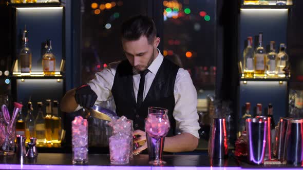 Bartender Filling Glasses with Ice in Nightclub