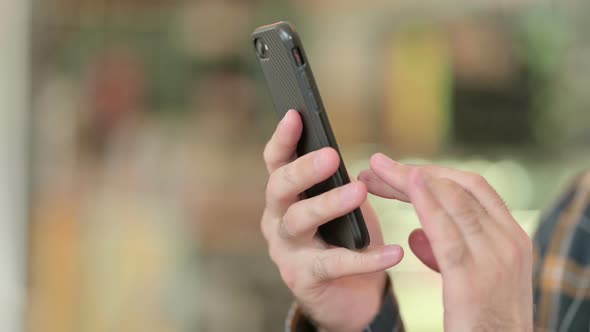 Close Up of Hand Texting on Smartphone