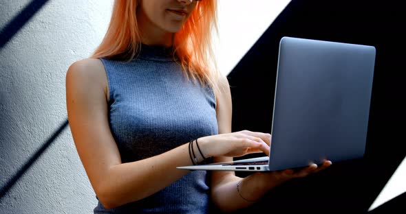 Woman with Spectacles Using Laptop