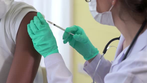 Young Man Visits Skillful Doctor at Hospital for Vaccination