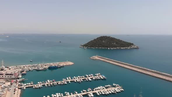 Sea harbour with boats and luxury white yachts, aerial view. 