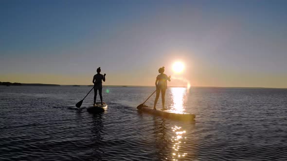 Women Walk on the Water on Sup Boards