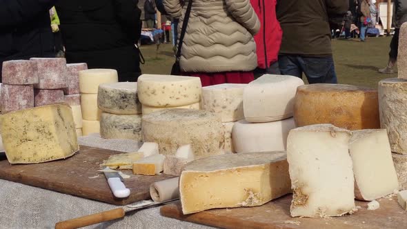 Farmers Market in an Outdoor Space Filled with Stalls Offering Artisan Cheese