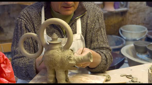 Potter working on clay sculpture