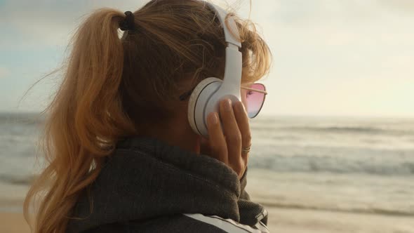 Listening To Music On The Beach