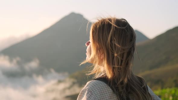 Girl Backpacker Staring at Mountain Scene