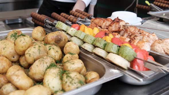 ReadytoEat Street Food Shashlik Potatoes Grilled Vegetables on Food Court