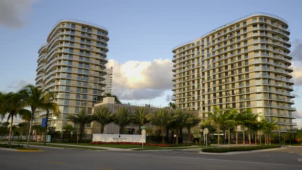 Modern condo apartments with palm trees shot with motion camera