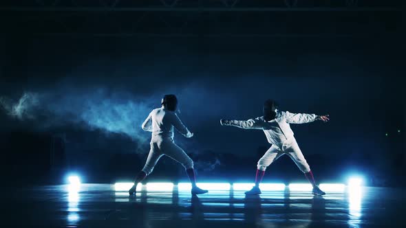 Athletes are Practicing Fencing in Slow Motion