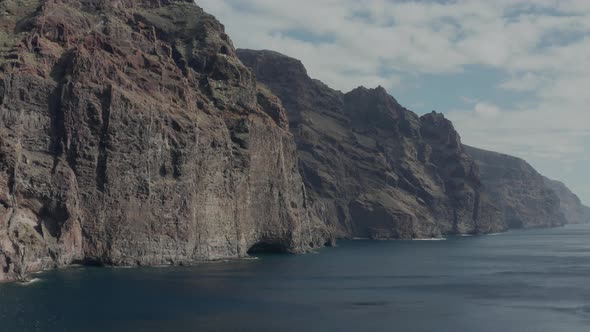 Aerial survey above the Atlantic Ocean in Tenerife, Canary islands, the rocks Los Gigantos