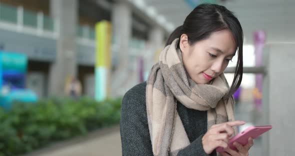 Woman use of smart phone in campus