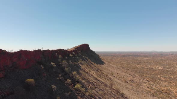 Rising aerial drone shot of bushland and Euro Ridge, Central Australia