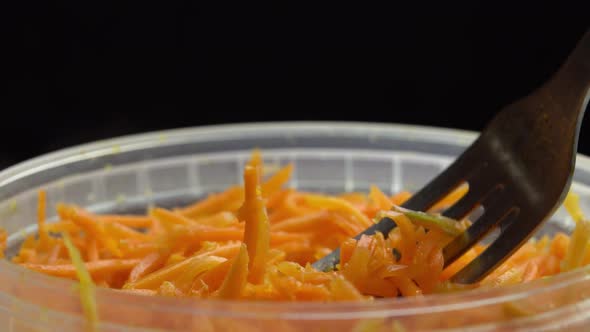 Chopped Spicy Carrots or Pickled Carrot Fork Takes a Korean Carrot That Rotates on a Black