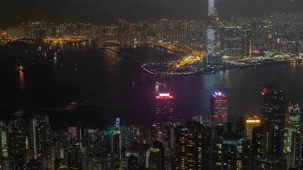 Hong Kong Urban Cityscape Aerial Skyline Panorama Timelapse at Night Pan Up