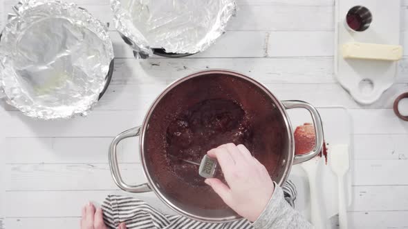 Time lapse. Flat lay. Step by step. Mixing ingredients in the cooking pot to make simple chocolate f