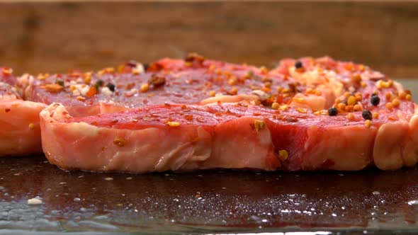 Closeup of a Steak Hissing and Frying on a Grill