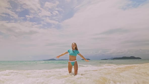 Woman Lying on Shallow Water Sea