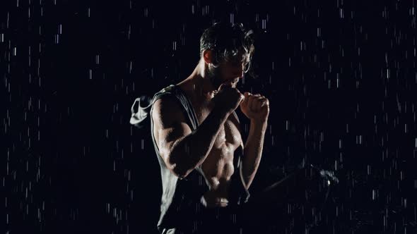 Athletic Man Working Out In The Rain