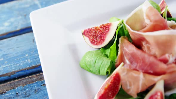 Raw meat and vegetables decorated on plate