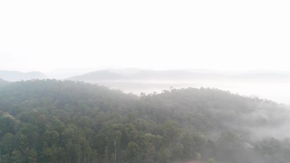 Aerial Footage of Green Mountains in the Foggy Weather