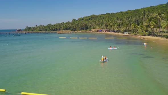 Aerial View Over Tourist Kayaking in a Tropical Resort on Summer