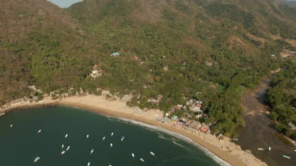 Secluded And Pristine Shore At The Yelapa Beach In Jalisco, Mexico. aerial tilt down, descending app