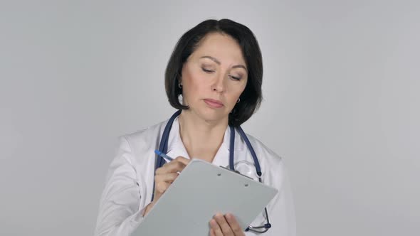 Lady Doctor Writing Medical Report on White Background