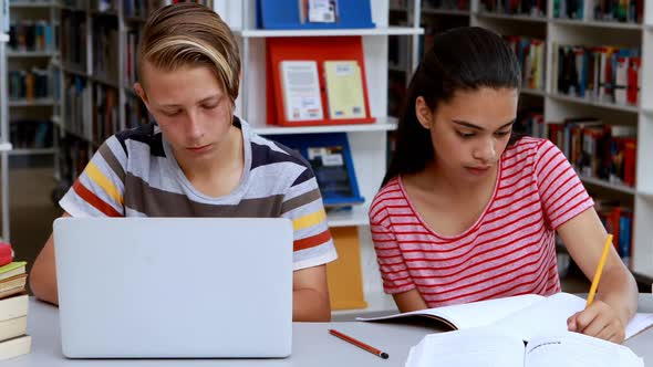 Attentive students studying in library