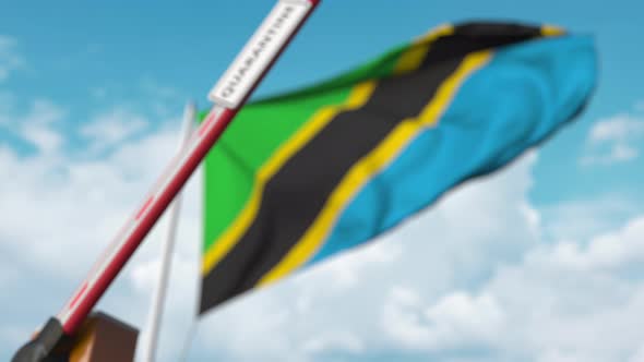 Closing Barrier with QUARANTINE Sign at the Tanzanian Flag