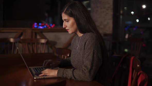 Attractive Adult Woman Working on a Laptop