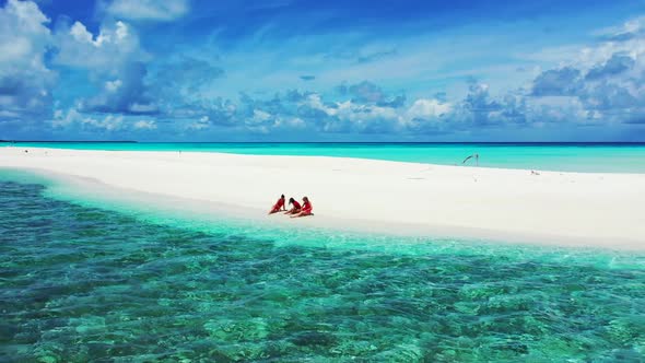 Women happy and smiling on paradise bay beach break by blue sea with white sandy background of the M