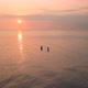 Two Young Women Enjoying an Incredible Orange Sunset in the Ocean.  - VideoHive Item for Sale