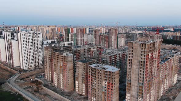 Construction Site with Highrise Buildings and Cranes