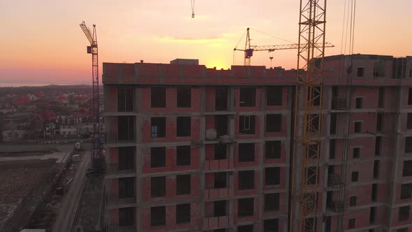 Construction Site in the Middle of the City and Private Houses at Sunset in .