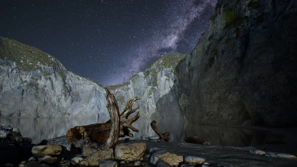 Hyperlapse of Night Starry Sky with Mountain and Ocean Beach in Lofoten Norway