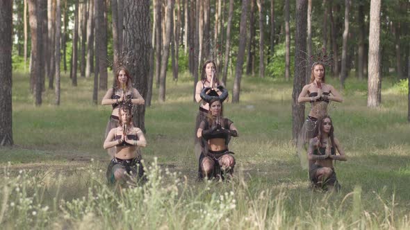 Group of Women Dancers with Make-up and in Mystical Fabulous Costumes Dancing Groovy Dance in Color