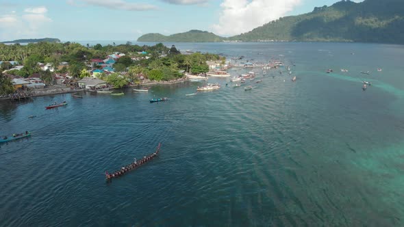 Aerial: kora-kora traditional canoe annual race in the Banda Islands Indonesia