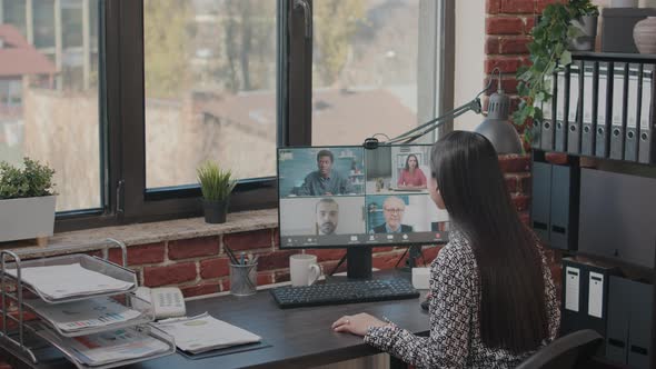 Employee Using Video Call to Talk to Workmates on Computer