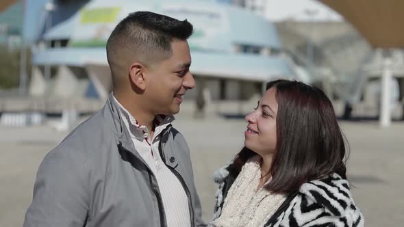 Happy Young Couple in Love Looking at Camera