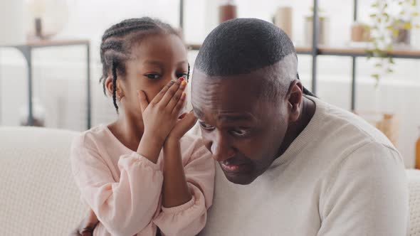 Little Girl Black Afro American Baby Granddaughter Child Says Secret to Grandfather in Ear Share