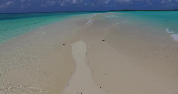 Tropical above clean view of a paradise sunny white sand beach and aqua blue water background in col