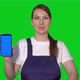Woman Builder in Blue Overalls Hold Mobile Phone with Green Screen - VideoHive Item for Sale