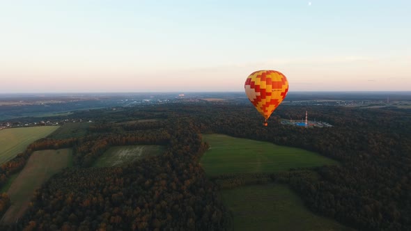 Hot Air Balloon in the Sky Over a Field.