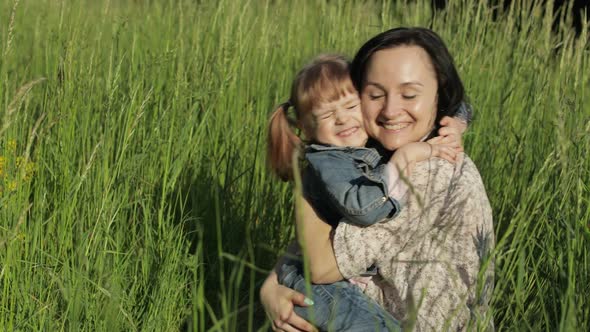 Family in Park Takes Off Medical Masks After Coronavirus Pandemic Quarantine End