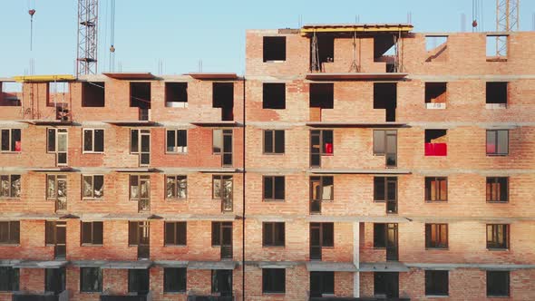 Aerial View of the Facade of a Residential Building Under Construction at Sunset