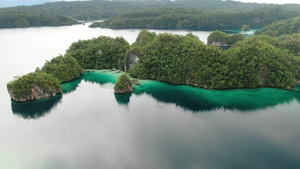 Triton Bay With Turquoise Sea And Green Tropical Trees In Kaimana Islands. 